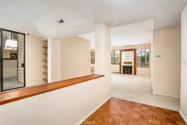 The formal entry leads to a massive living room. The area to the left can easily be enclosed into Bedroom #3!