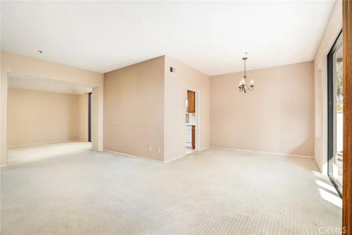 This view looks towards the dining room and flex room which can easily be bedroom #3/office. Take down the walls at the kitchen and you have a dream space for your new kitchen & great room!