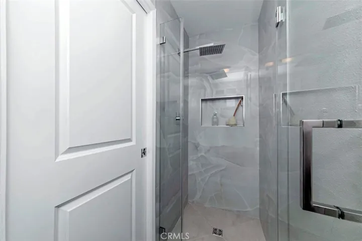 New shower with "rain forest" showerhead in primary bathroom.