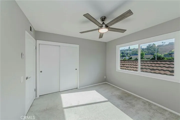 Upstairs bedroom with new ceiling fan.