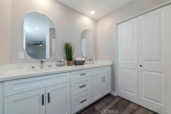 Primary bathroom has been totally remodeled, features double sinks, modern faucets, 2 closets with new bi-fold doors.