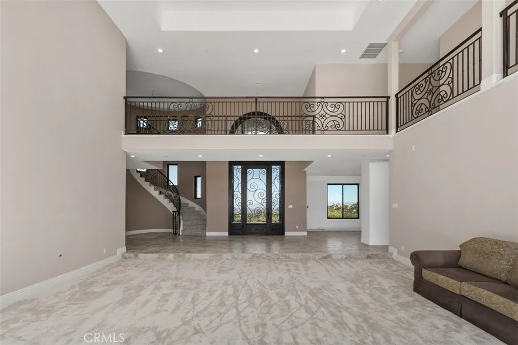 formal living room and entry with custom steel doors