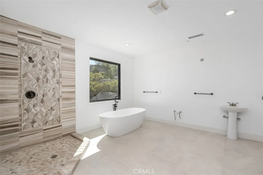 primary bath needs cabinetry, counter tops, sinks & mirror. See virtually created photo for visual purposes only