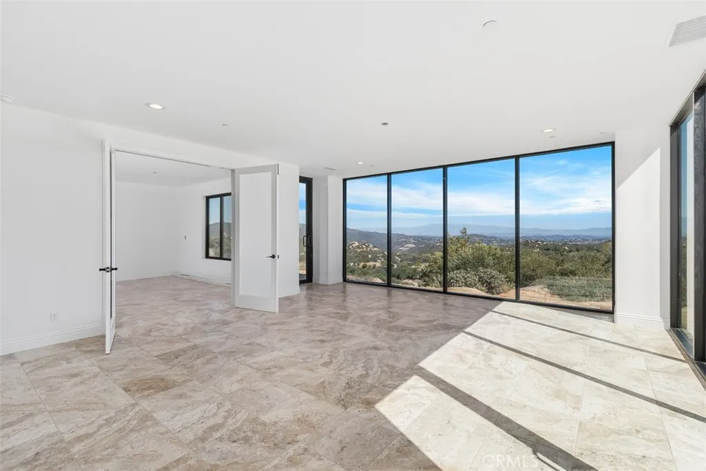 Family room with floor to ceiling windows to enjoy the Million $$$ views