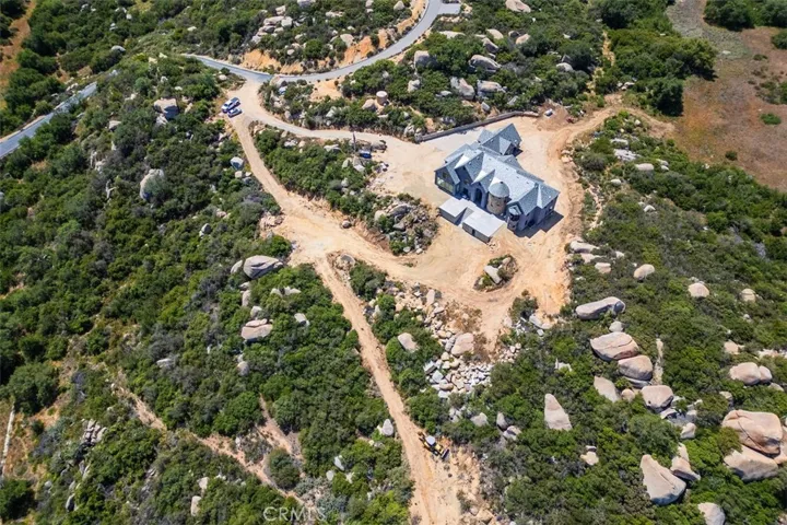 Aerial view of a portion of the property, complimented with natural boulder outcroppings and breathtaking ancient Oak tree's