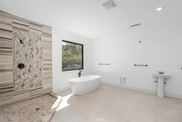 primary bath needs cabinetry, counter tops, sinks & mirror. See virtually created photo for visual purposes only