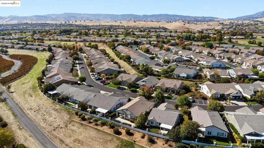 Aerial view of residential area featuring mountains