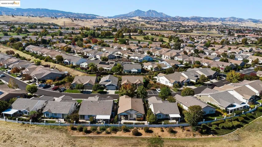 Aerial view of residential area featuring mountains