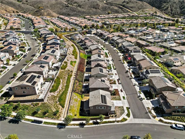 View of home from above. Corner lot, solar on roof