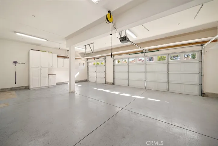 3 car garage with epoxy flooring