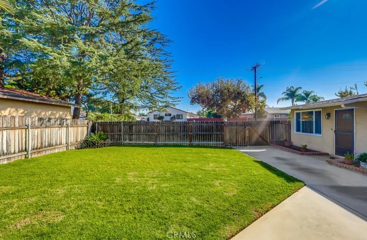 Yard behind front fence.