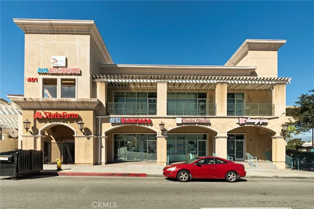 Building front. Office unit is the bottom left, State Farm