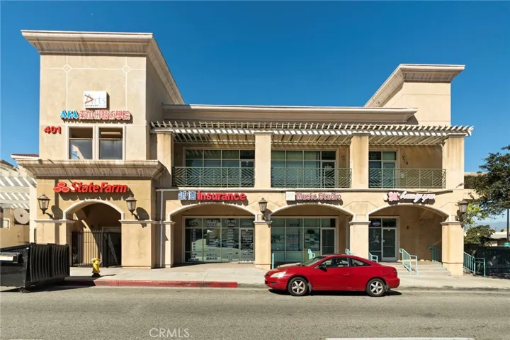 Building front. Office unit is the bottom left, State Farm
