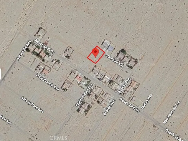 Aerial view with surrounding homes.