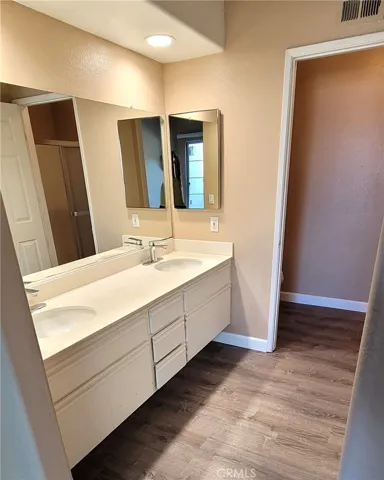 Bathroom is Spacious with Dual Sinks.
