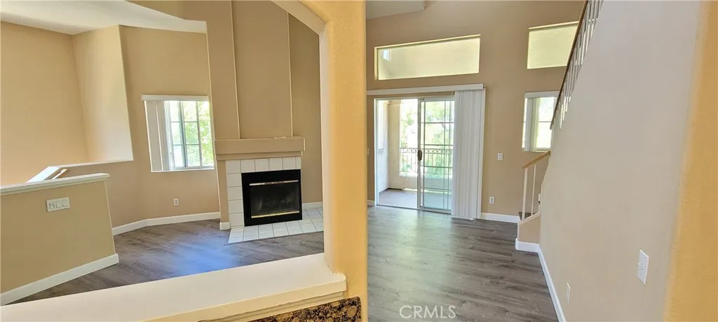 Views from Kitchen, looking out to the Living Room, Fireplace and Sliding Door which opens to the Large Balcony!