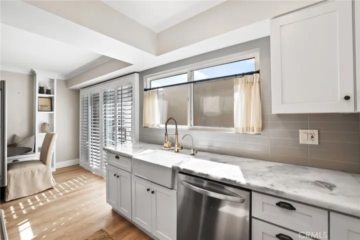 Designer kitchen with soft earth tones, natural stone counters and tile back splash.  Upgraded faucet and water filtration.