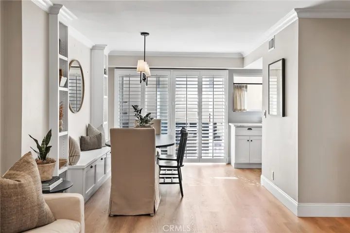 Dining room with updated lighting base and casing throughout.