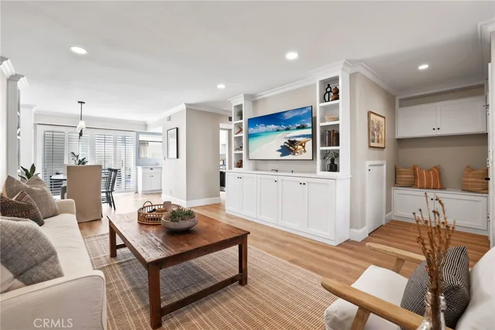 Living room with built in storage and TV wall