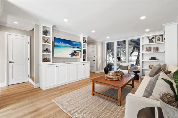Living room, updated recessed lighting throughout and LVP flooring.