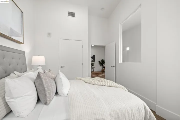 Bedroom with baseboards and wood finished floors