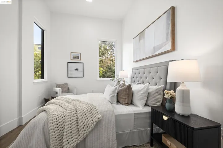 Bedroom featuring baseboards and wood finished floors