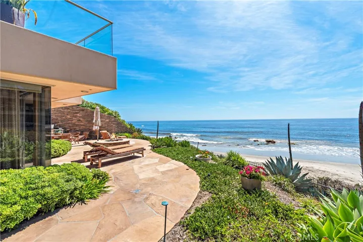 Prime, corner unit location provides a 1200 square foot wraparound deck complete with built-in BBQ, fire pit, and breathtaking, ocean front views.
