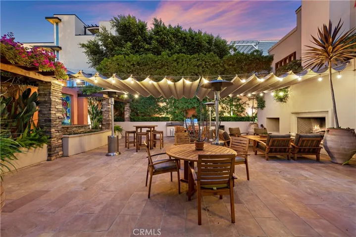 The communal courtyard offers a bar, TV, barbecue, couches, fireplace, tables and chairs for resident gatherings or upscale private events.