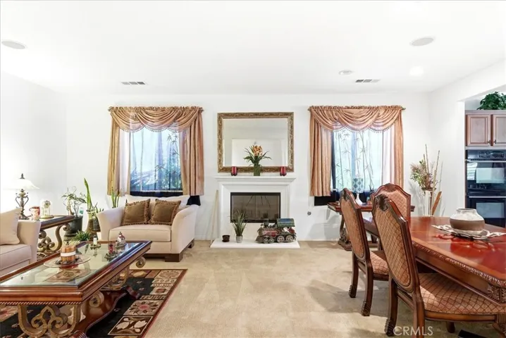 Living room area and dinning room area with Fireplace.