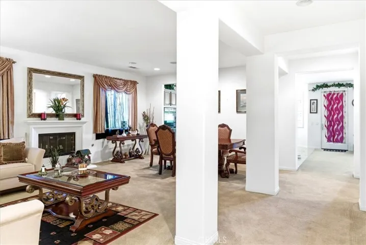 Living room area and dinning room area with cozy fireplace.