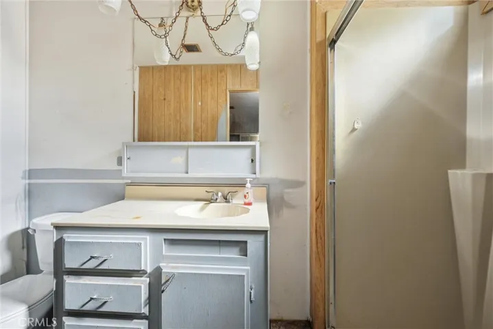 Primary bathroom with step in shower.