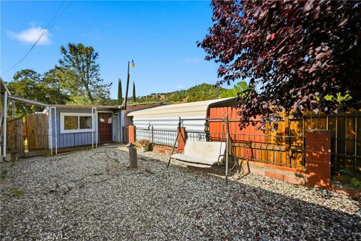 Gate to the left leads to enclosed gardening area.
