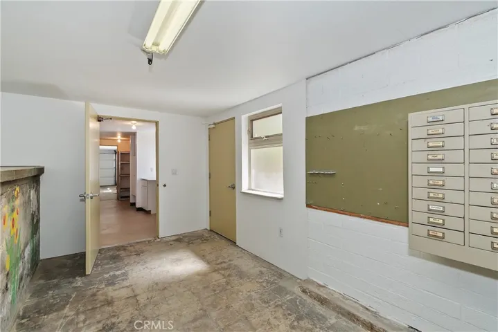 Bottom Level Storage/Workshop With Exterior Access