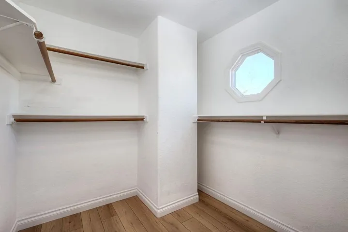 Large walk-in closet in primary bedroom #1