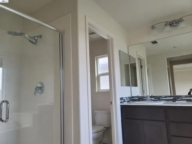 Separate tub and shower with 2 vanities