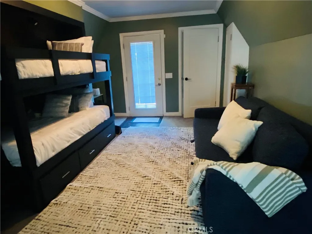 Loft showing door to 2nd deck and entry from Holiday
