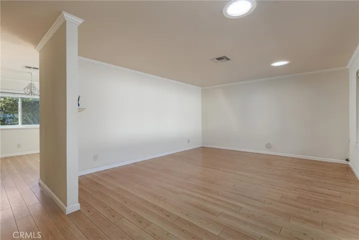 Front sitting room looking into dining  area separation .