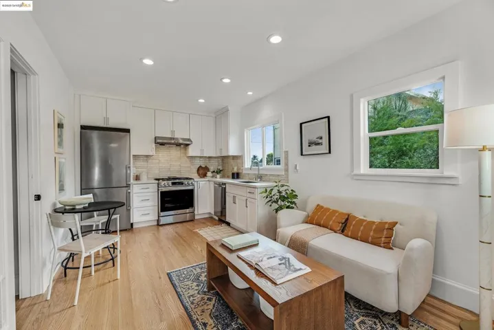 Living room featuring light wood-type flooring and recessed lighting