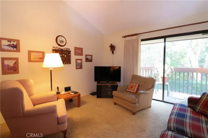 Upstairs den/ bedroom/office with its own deck looking toward backyard.