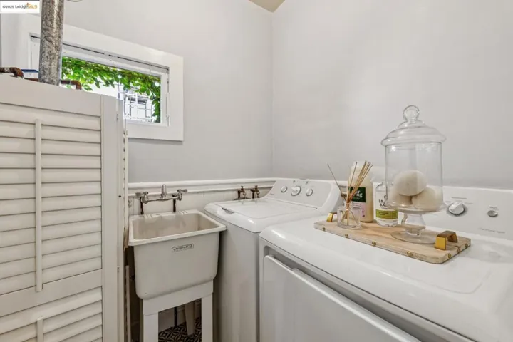Washroom featuring washing machine and clothes dryer