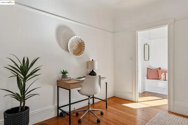 Office space featuring light wood-style flooring and baseboards