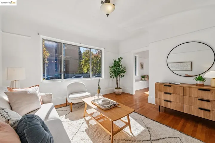 Living room with wood finished floors and baseboards
