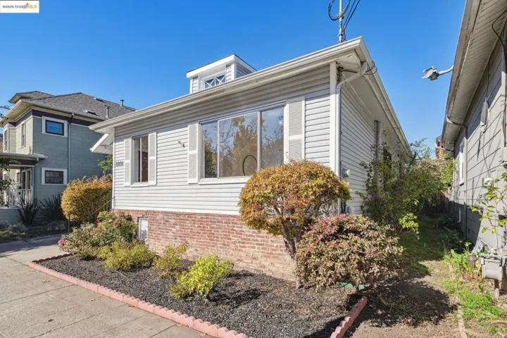 View of property exterior featuring brick siding