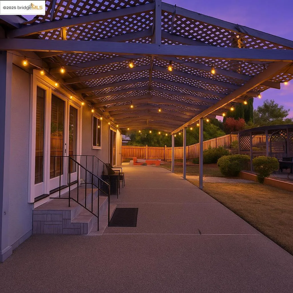 Patio terrace at dusk with a fenced backyard and a patio