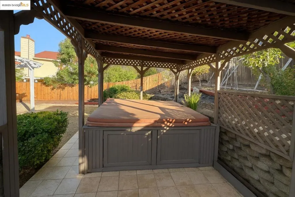 View of patio featuring a hot tub