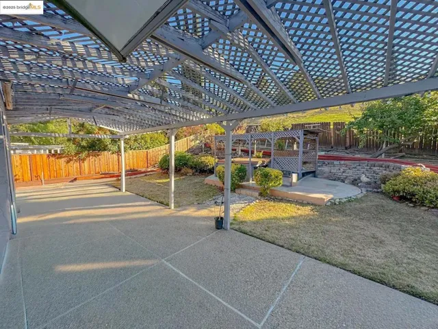 View of car parking featuring a fenced backyard