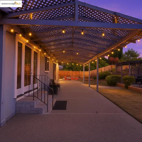 Patio terrace at dusk with a fenced backyard and a patio