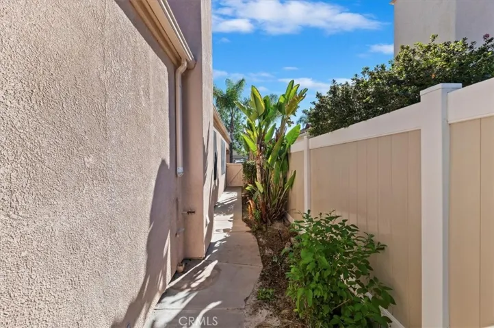 Side yard with vinyl fencing