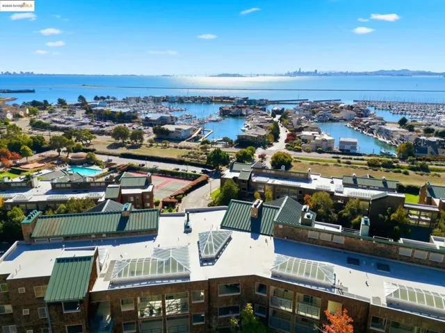 Bird's eye view of numerous boat docks and a nearby body of water