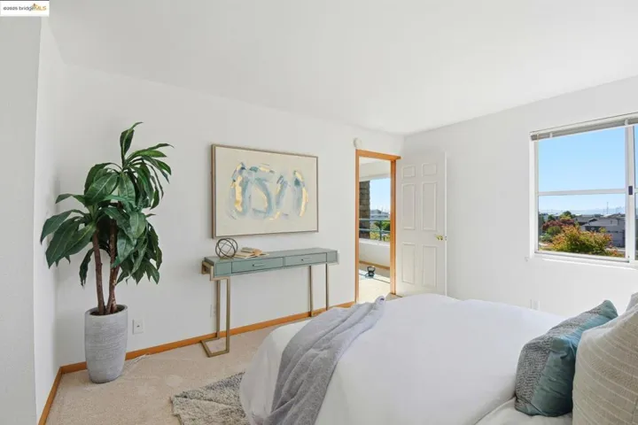 Bedroom featuring baseboards and carpet